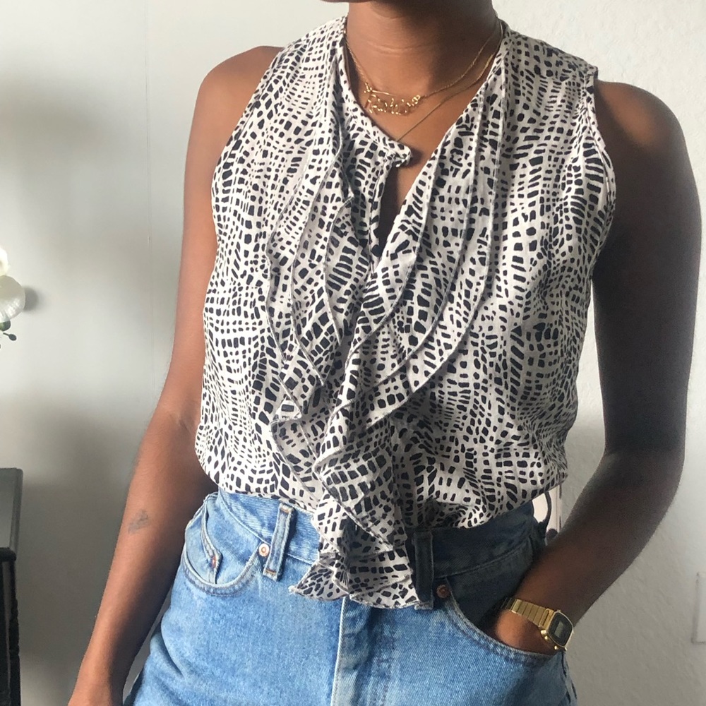 Elena Solano ruffle neck detail shirt.